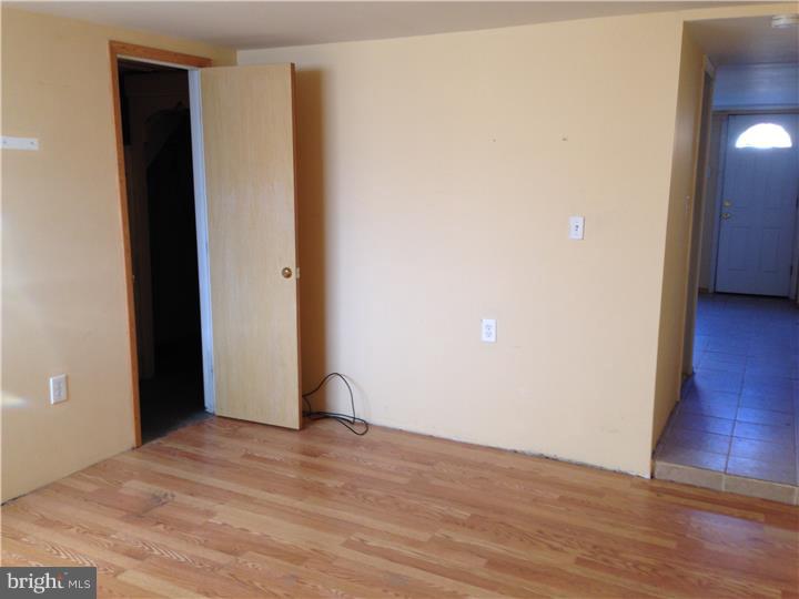 6316 Jackson Street Philadelphia, PA 19135 - Photo 10 of 14 a view of a room with wooden floor