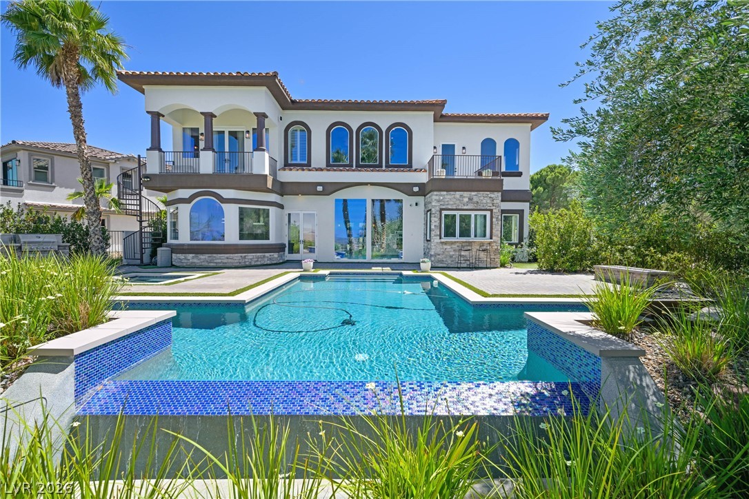 6 Rue Du Ville Henderson, NV 89011 - Photo 73 of 99 This grand residence showcases an expansive pool and ample outdoor living space.