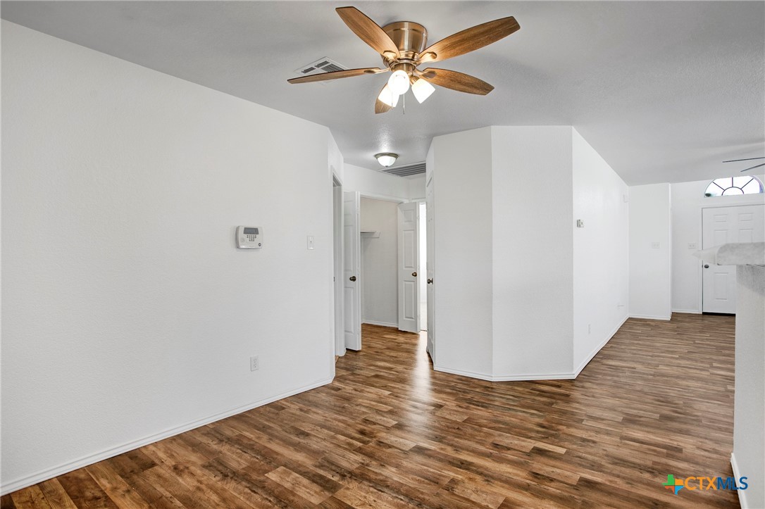 2010 Wright Way Killeen, TX 76543 - Photo 13 of 27 a view of a big room with wooden floor and a ceiling fan
