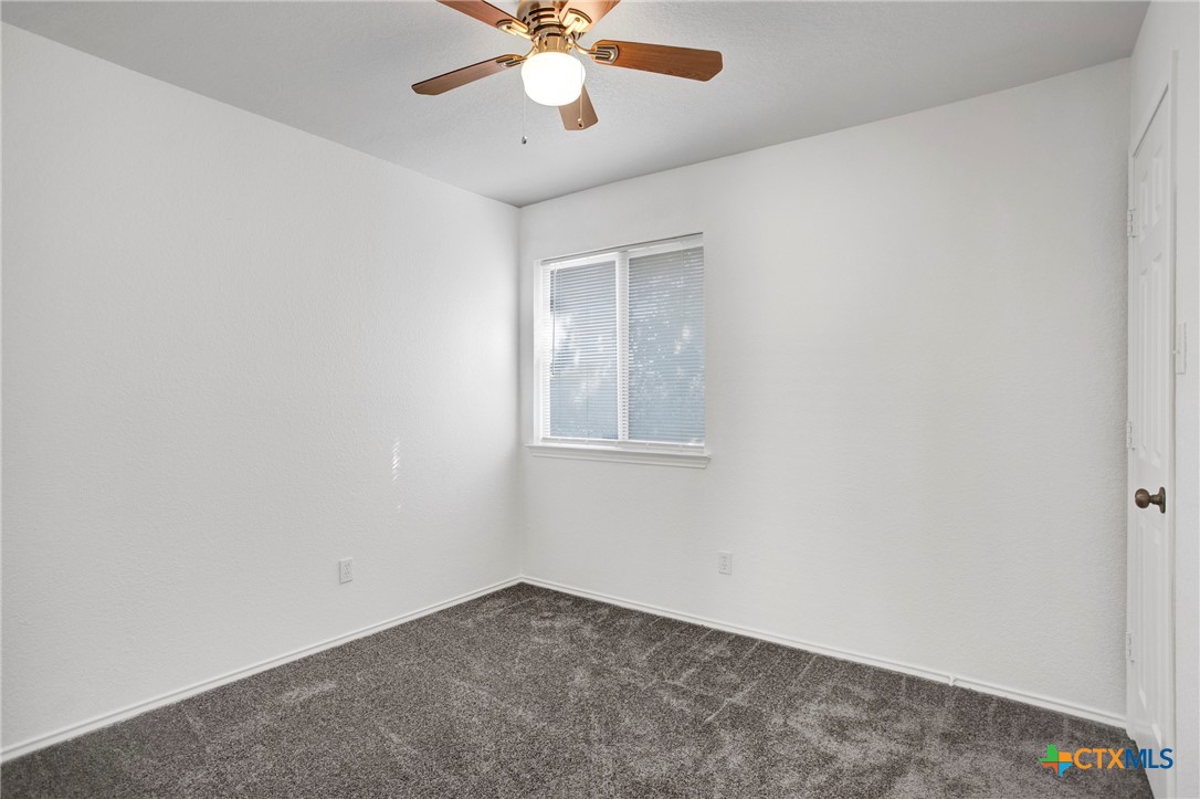2010 Wright Way Killeen, TX 76543 - Photo 14 of 27 an empty room with a window and a fan