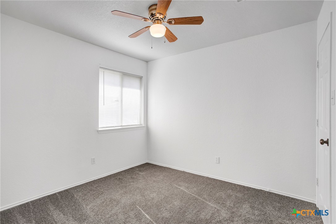 2010 Wright Way Killeen, TX 76543 - Photo 16 of 27 an empty room with a window and a fan