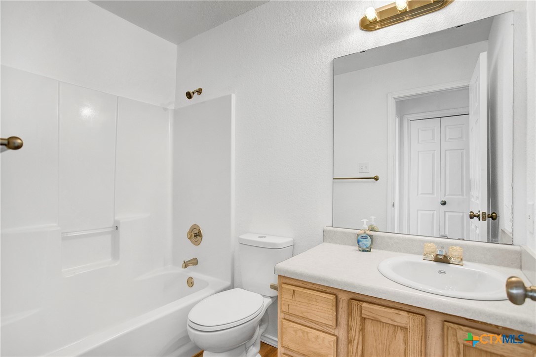 2010 Wright Way Killeen, TX 76543 - Photo 18 of 27 a bathroom with a sink a toilet and shower