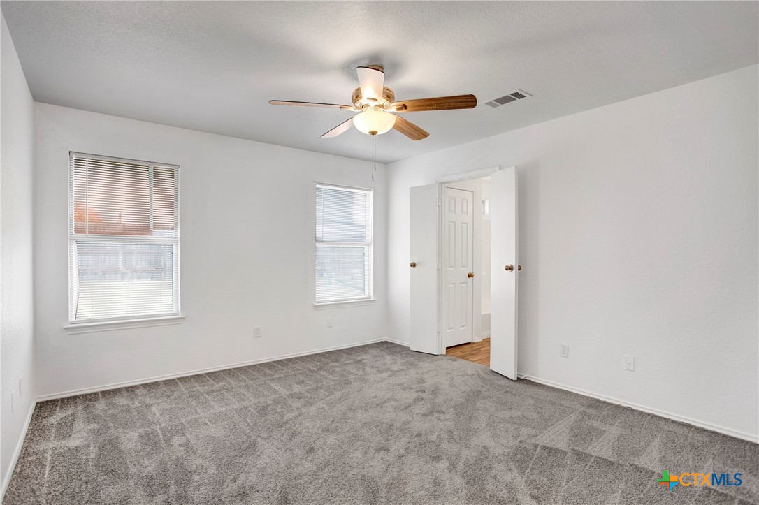 2010 Wright Way Killeen, TX 76543 - Photo 19 of 27 an empty room with windows and fan