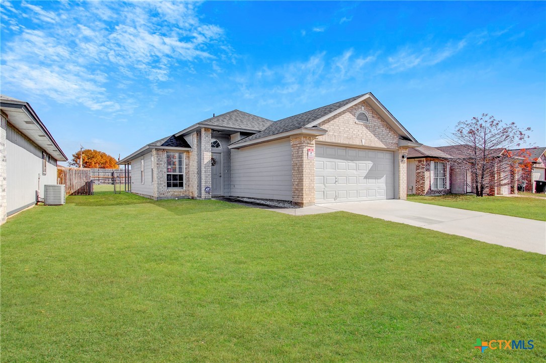 2010 Wright Way Killeen, TX 76543 - Photo 2 of 27 a front view of house with yard and green space