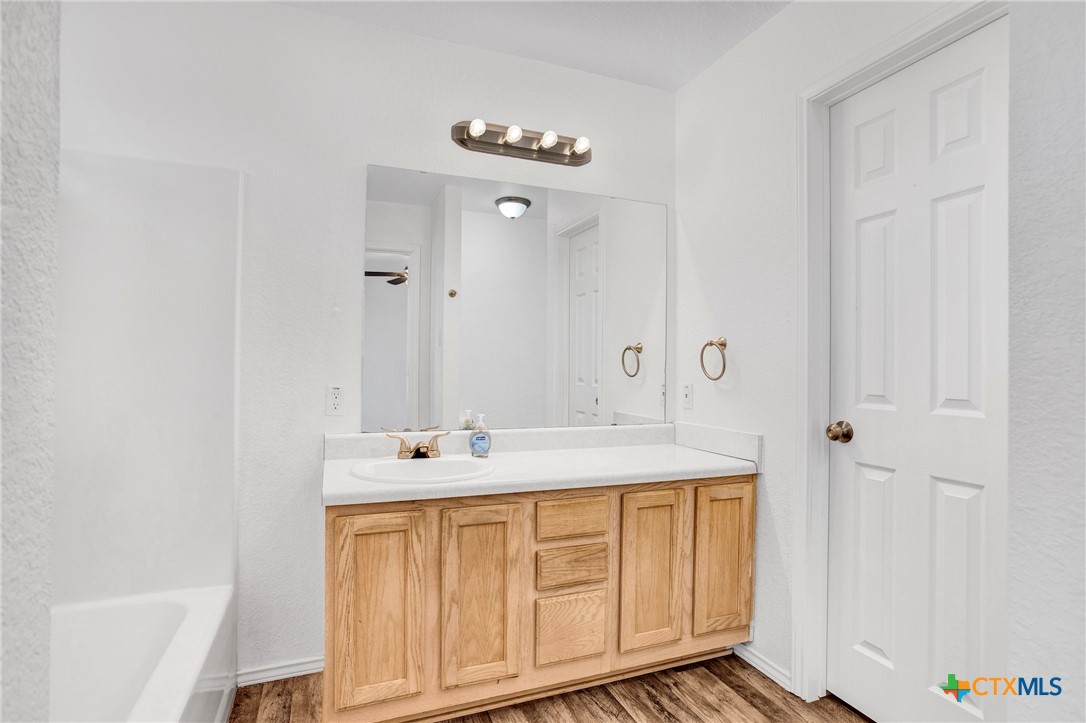 2010 Wright Way Killeen, TX 76543 - Photo 21 of 27 a bathroom with a sink a vanity and a mirror