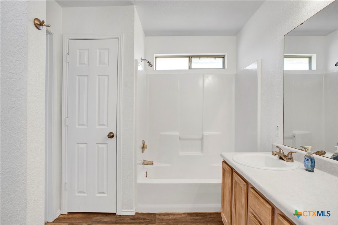 2010 Wright Way Killeen, TX 76543 - Photo 22 of 27 a bathroom with a sink a shower and a mirror