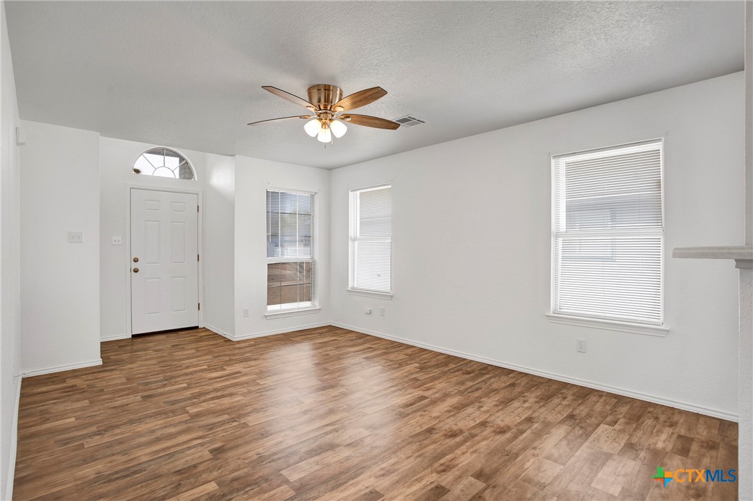 2010 Wright Way Killeen, TX 76543 - Photo 4 of 27 a view of an empty room with a window and wooden floor