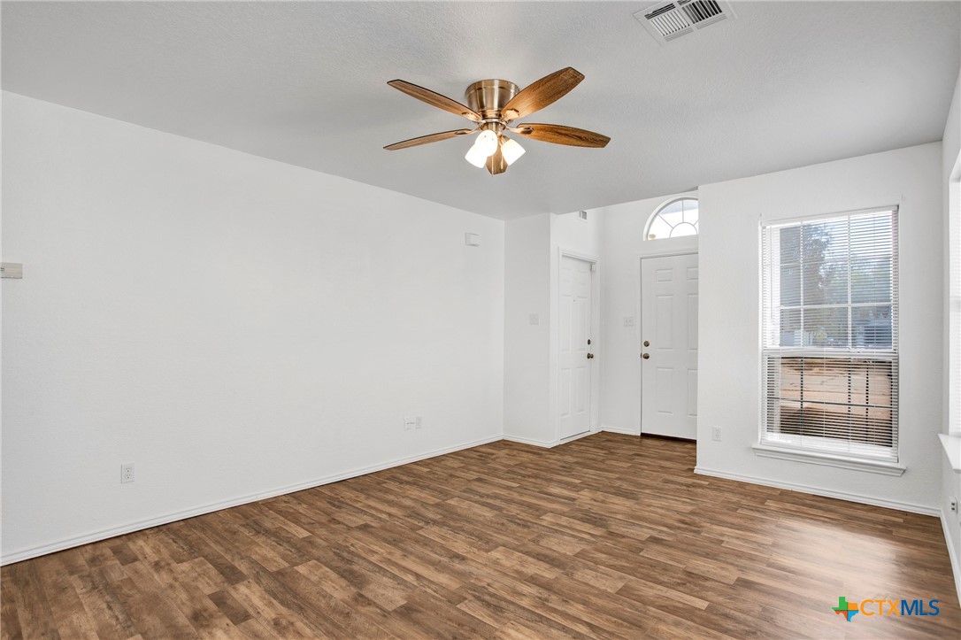 2010 Wright Way Killeen, TX 76543 - Photo 6 of 27 a view of a room with wooden floor and a ceiling fan