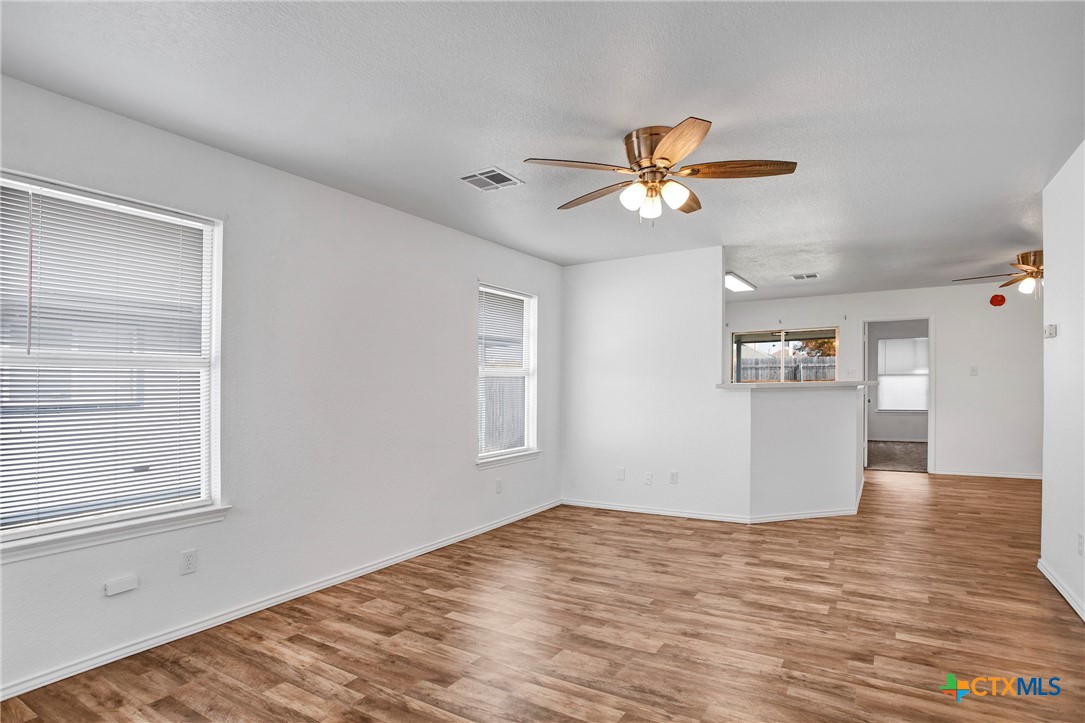 2010 Wright Way Killeen, TX 76543 - Photo 7 of 27 a view of a kitchen with wooden cabinet and a ceiling fan