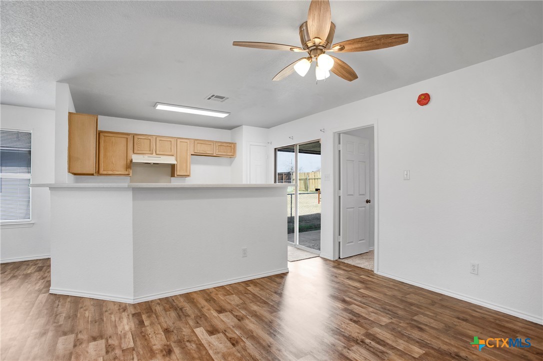2010 Wright Way Killeen, TX 76543 - Photo 8 of 27 a view of a kitchen with wooden floor and a ceiling fan