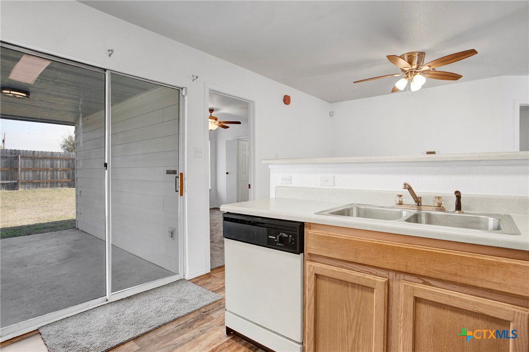 2010 Wright Way Killeen, TX 76543 - Photo 10 of 27 a kitchen with a sink and a refrigerator