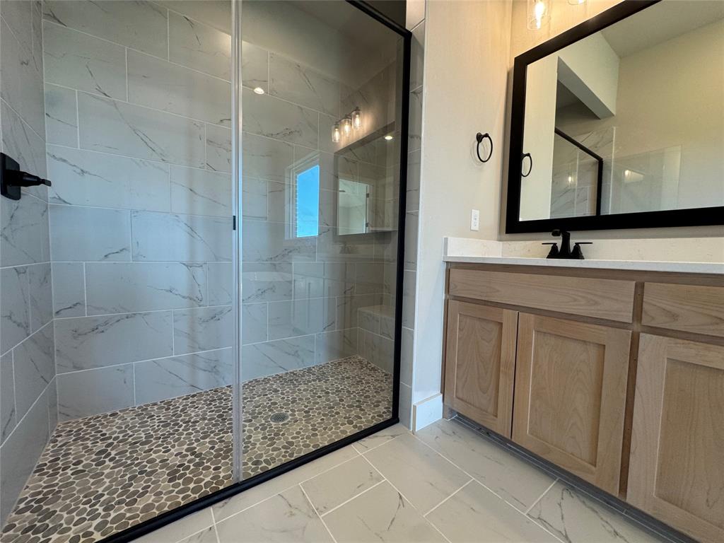 129 Mikasi Street Godley, TX 76044 - Photo 12 of 21 a bathroom with a bathtub shower sink and mirror