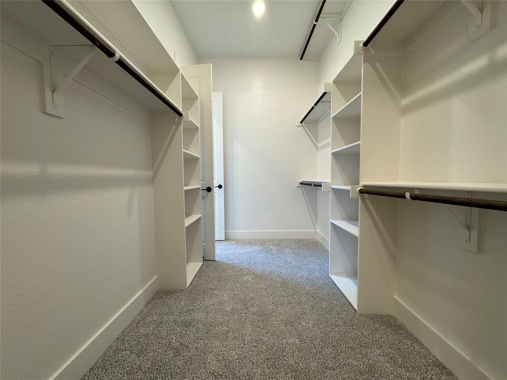 129 Mikasi Street Godley, TX 76044 - Photo 14 of 21 a view of walk in closet with empty racks