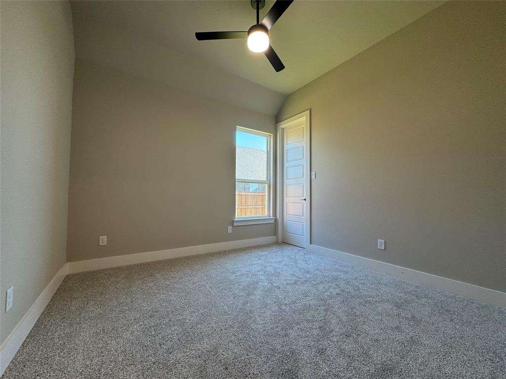 129 Mikasi Street Godley, TX 76044 - Photo 17 of 21 en empty room with windows and fan