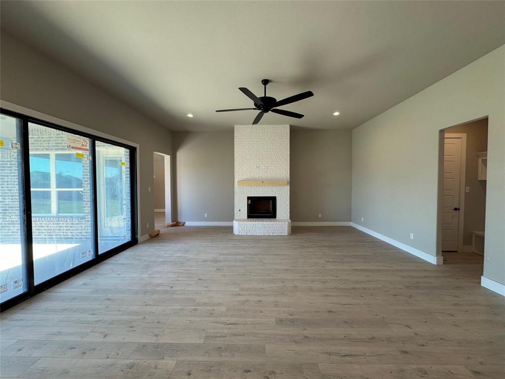129 Mikasi Street Godley, TX 76044 - Photo 4 of 21 a view of a livingroom with a ceiling fan and window