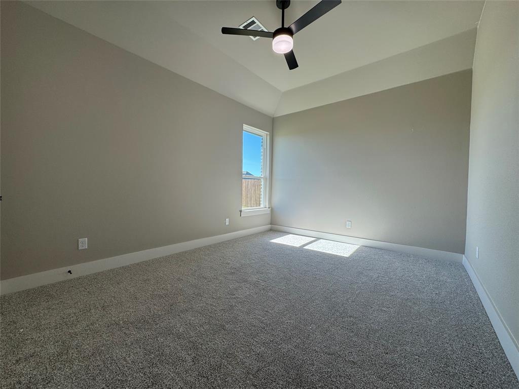 129 Mikasi Street Godley, TX 76044 - Photo 7 of 21 an empty room with a window and a fan