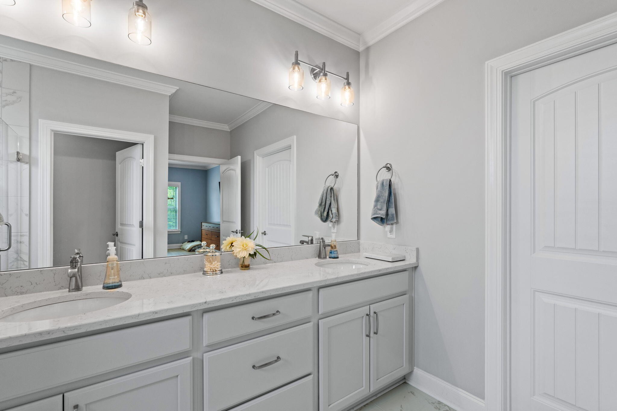 3144 Destination Trail Northwest Cleveland, TN 37312 - Photo 16 of 33 a bathroom with double vanity sinks and a mirror