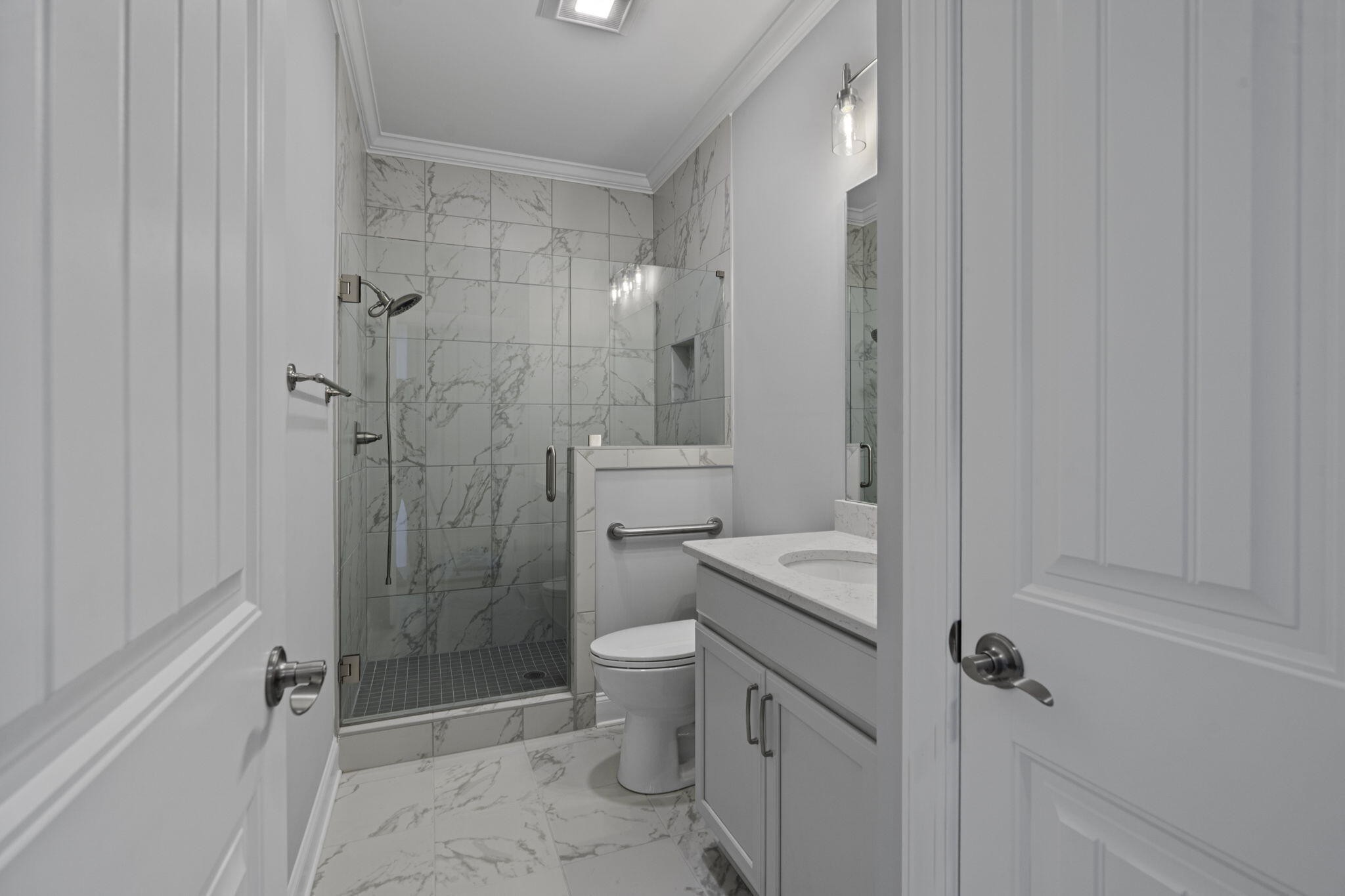 3144 Destination Trail Northwest Cleveland, TN 37312 - Photo 20 of 33 a bathroom with a granite countertop sink a toilet and shower