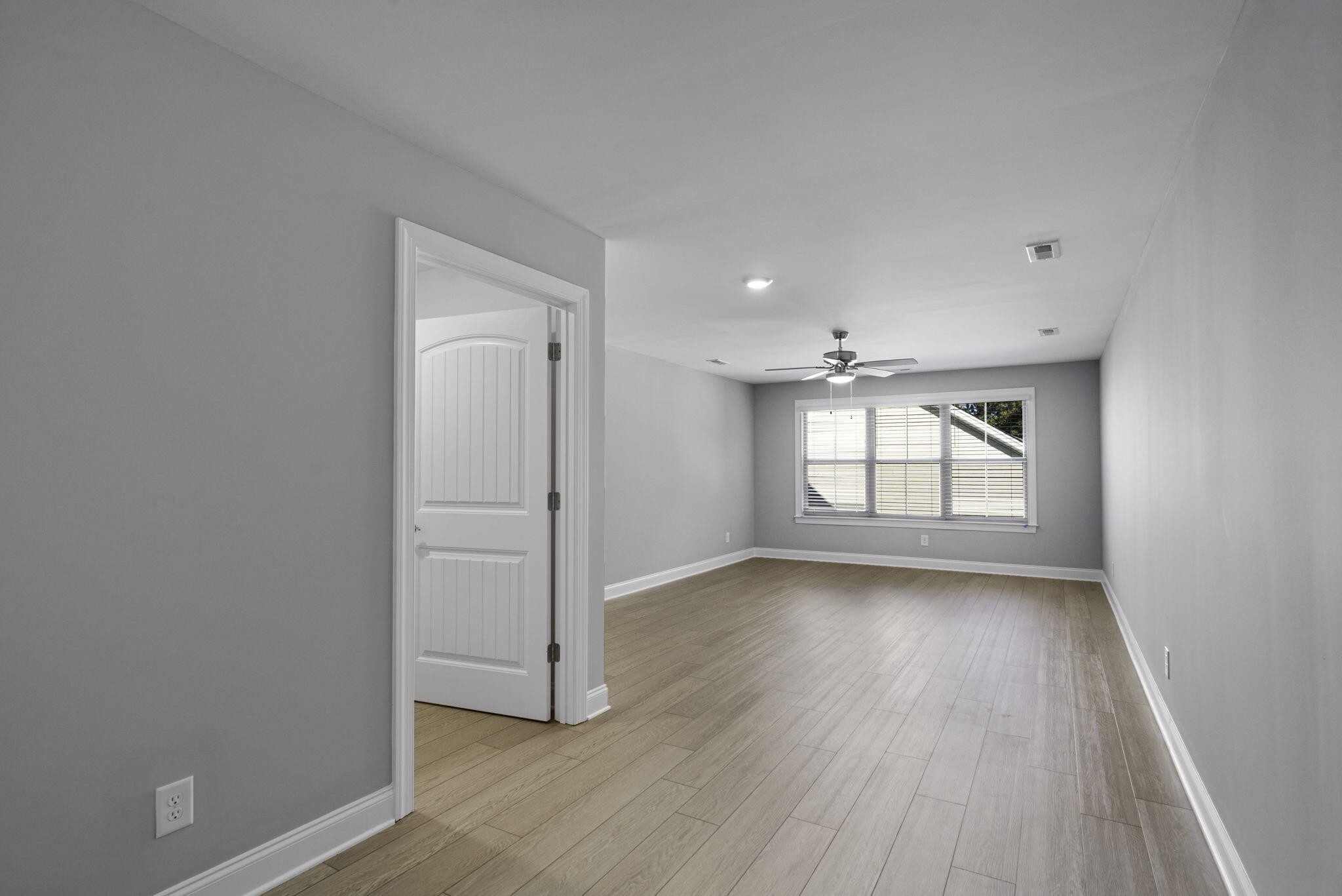 3144 Destination Trail Northwest Cleveland, TN 37312 - Photo 24 of 33 an empty room with wooden floor and windows