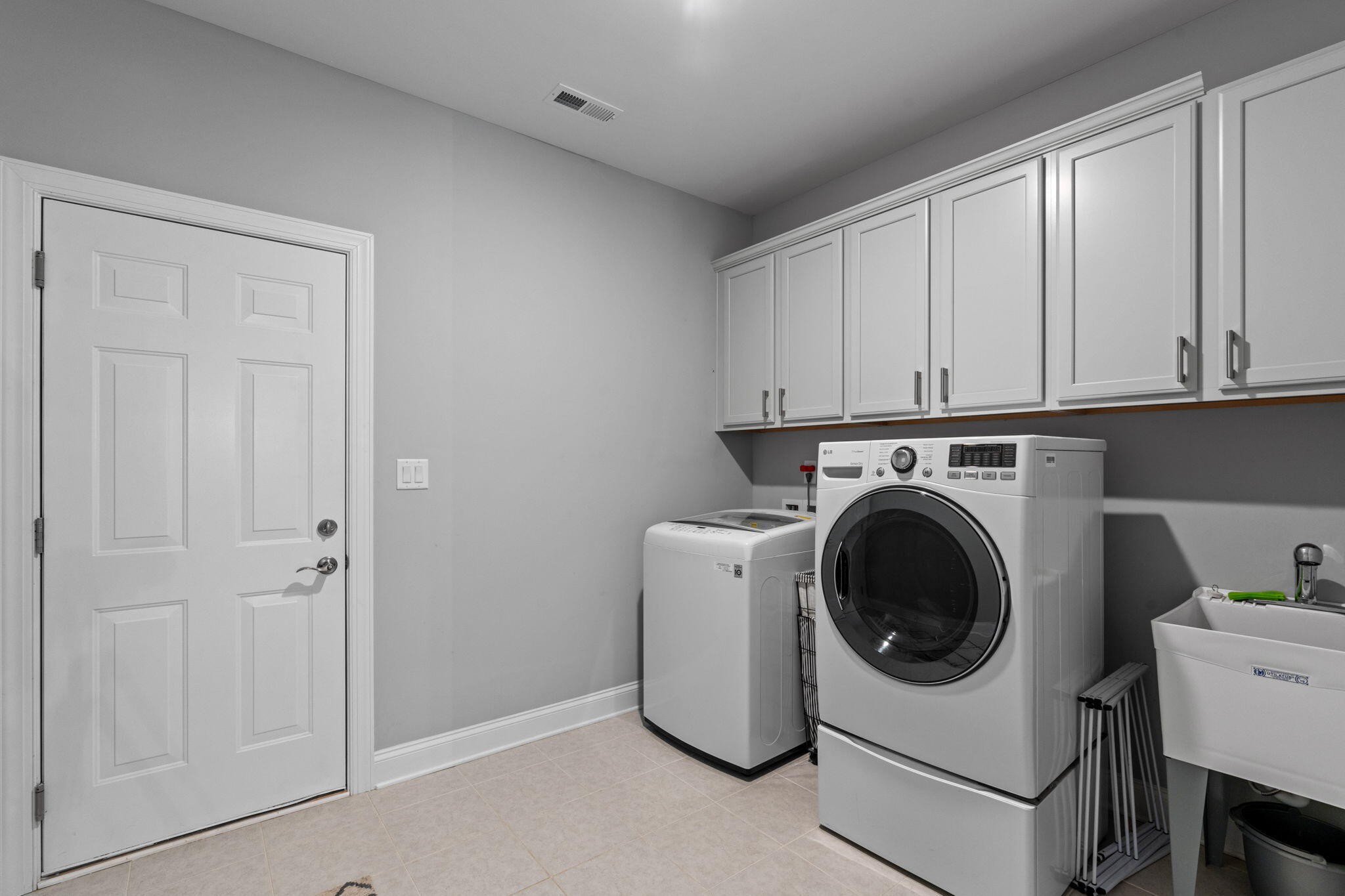 3144 Destination Trail Northwest Cleveland, TN 37312 - Photo 33 of 33 a utility room with sink dryer and washer