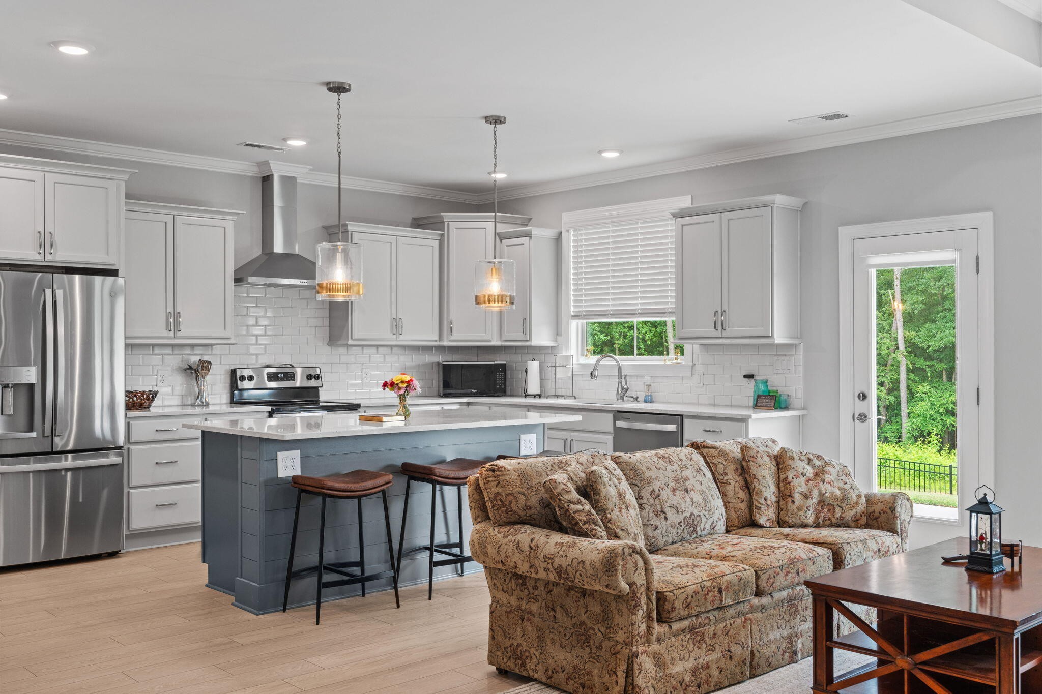 3144 Destination Trail Northwest Cleveland, TN 37312 - Photo 5 of 33 a living room with stainless steel appliances granite countertop furniture wooden floor and a window