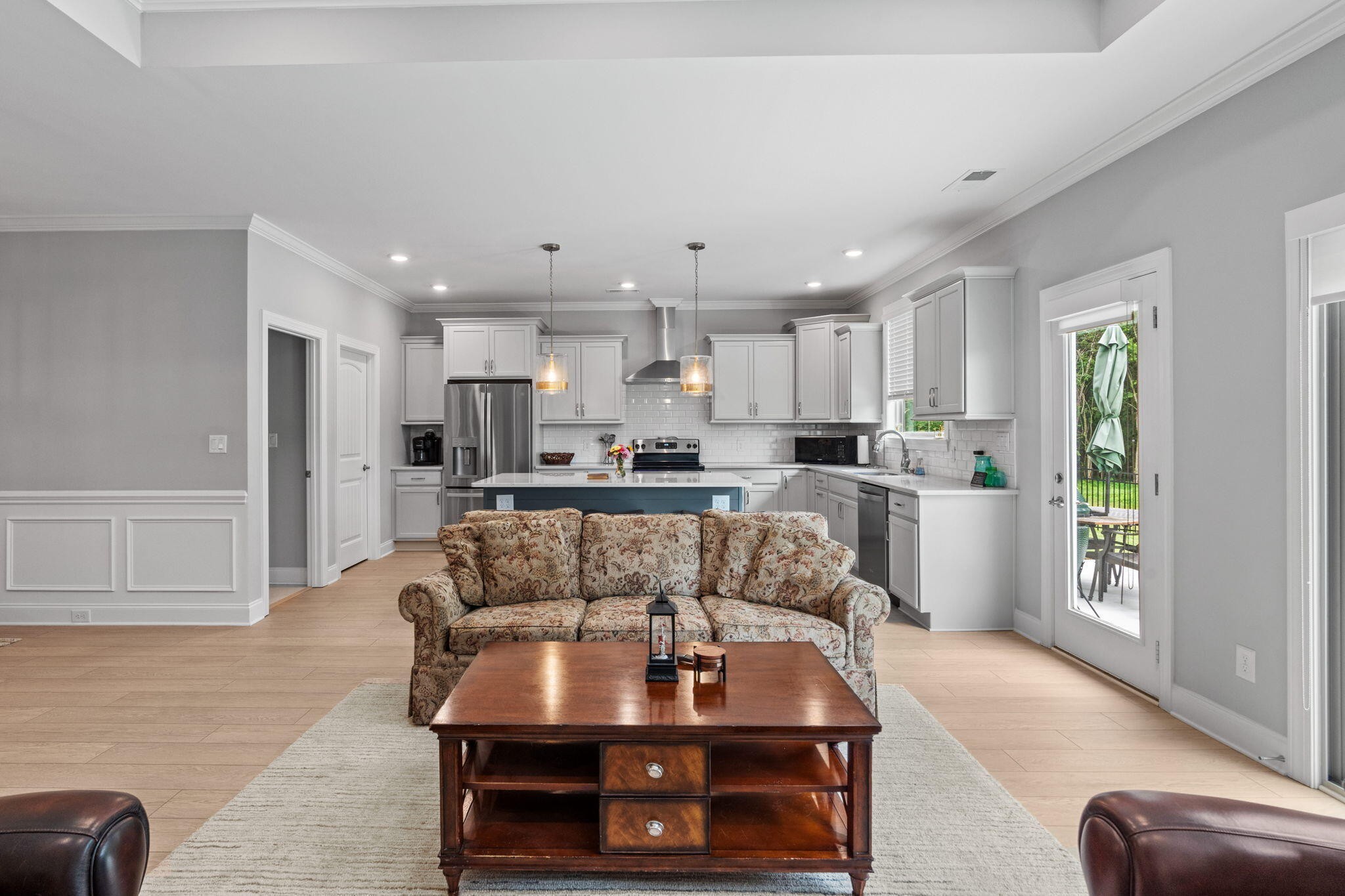 3144 Destination Trail Northwest Cleveland, TN 37312 - Photo 6 of 33 a kitchen with kitchen island granite countertop a stove a sink a refrigerator and white cabinets with wooden floor
