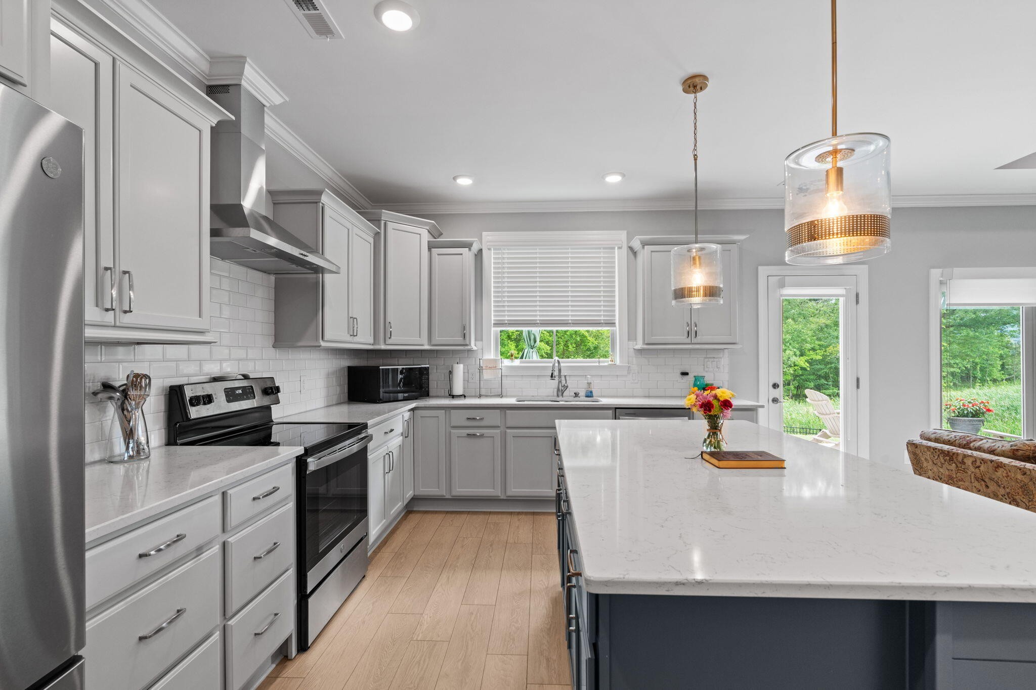 3144 Destination Trail Northwest Cleveland, TN 37312 - Photo 8 of 33 a kitchen with appliances a sink and cabinets