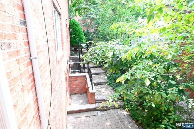 a backyard of a house with outdoor seating