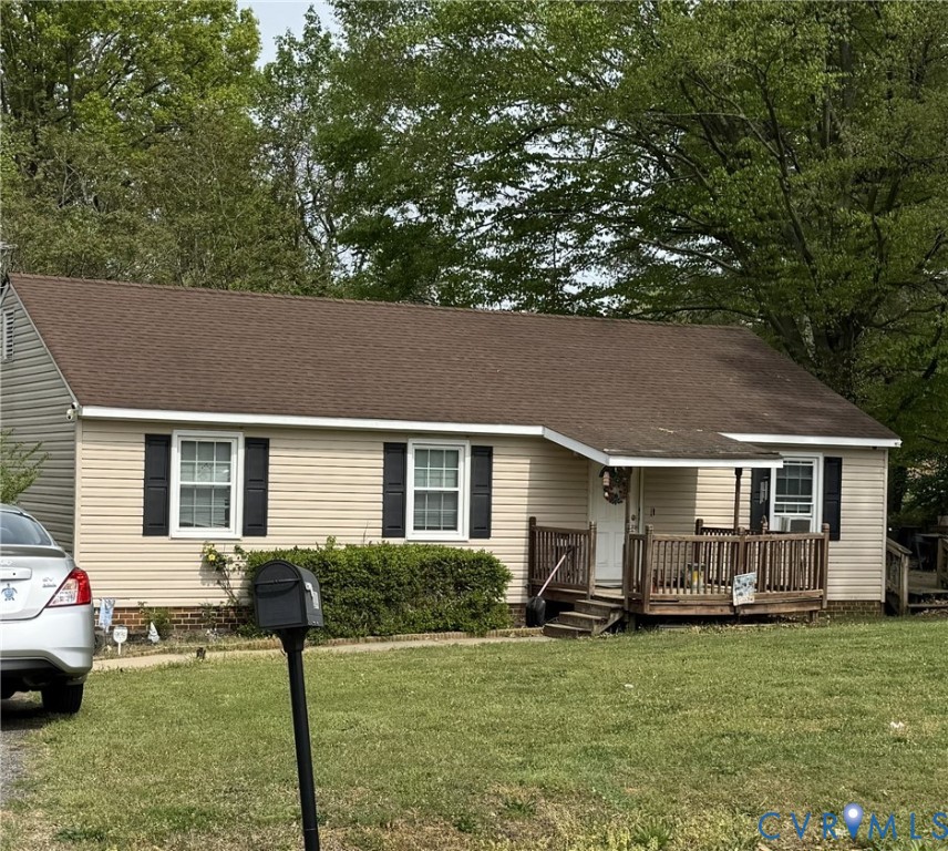 a front view of house with yard patio and green space