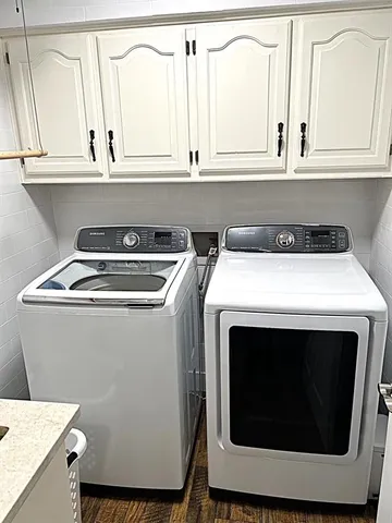 a bathroom with a sink a mirror a toilet and a window