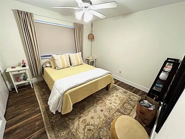 a bedroom with a bed and a mirror