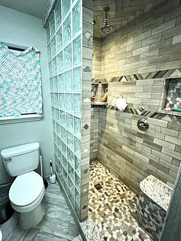 a bedroom with a bed and a mirror