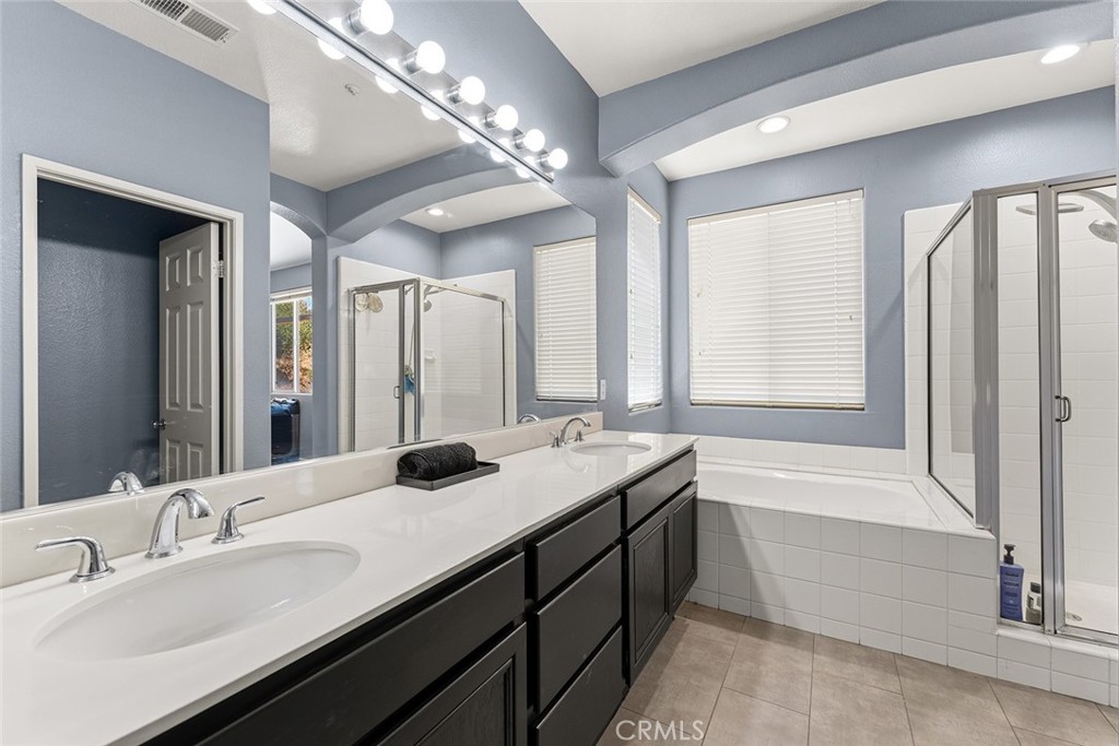 17229 Prairie Mile Road Ramona, CA 92065 - Photo 16 of 32 a bathroom with a tub sink and mirror
