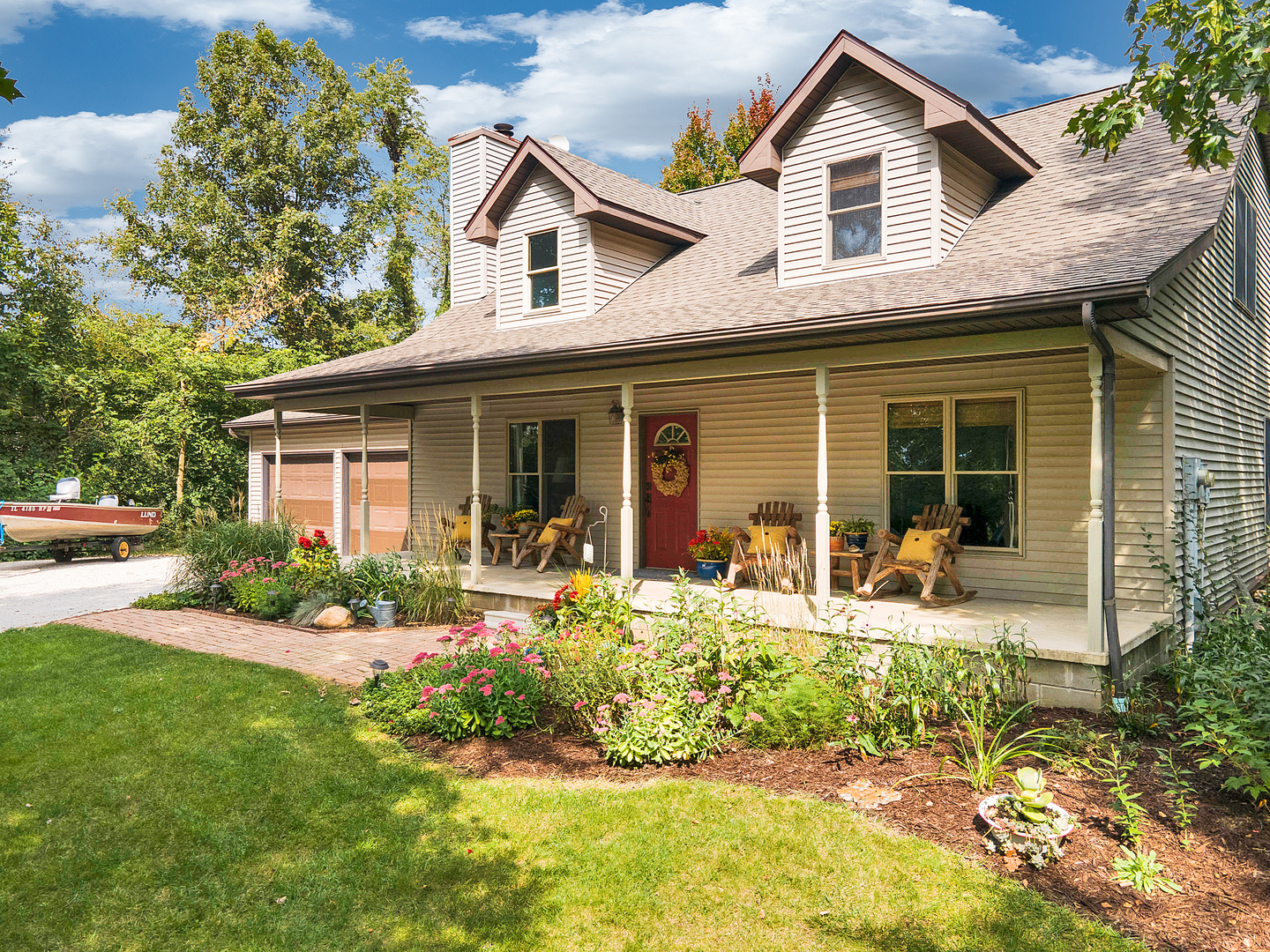 804 Kickapoo Drive Danvers, IL 61732 - Photo 1 of 33 a front view of a house with yard outdoor seating and porch