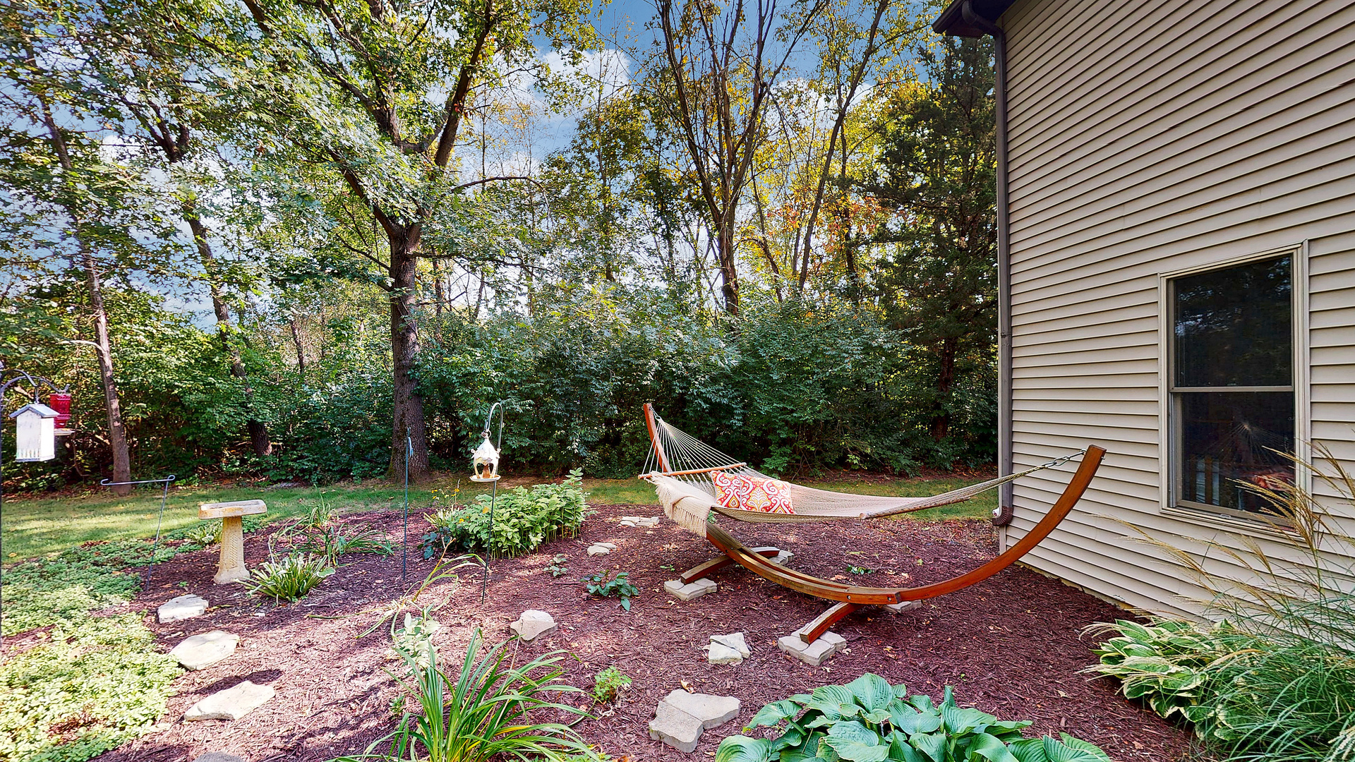 804 Kickapoo Drive Danvers, IL 61732 - Photo 11 of 33 a view of a backyard with plants and outdoor seating