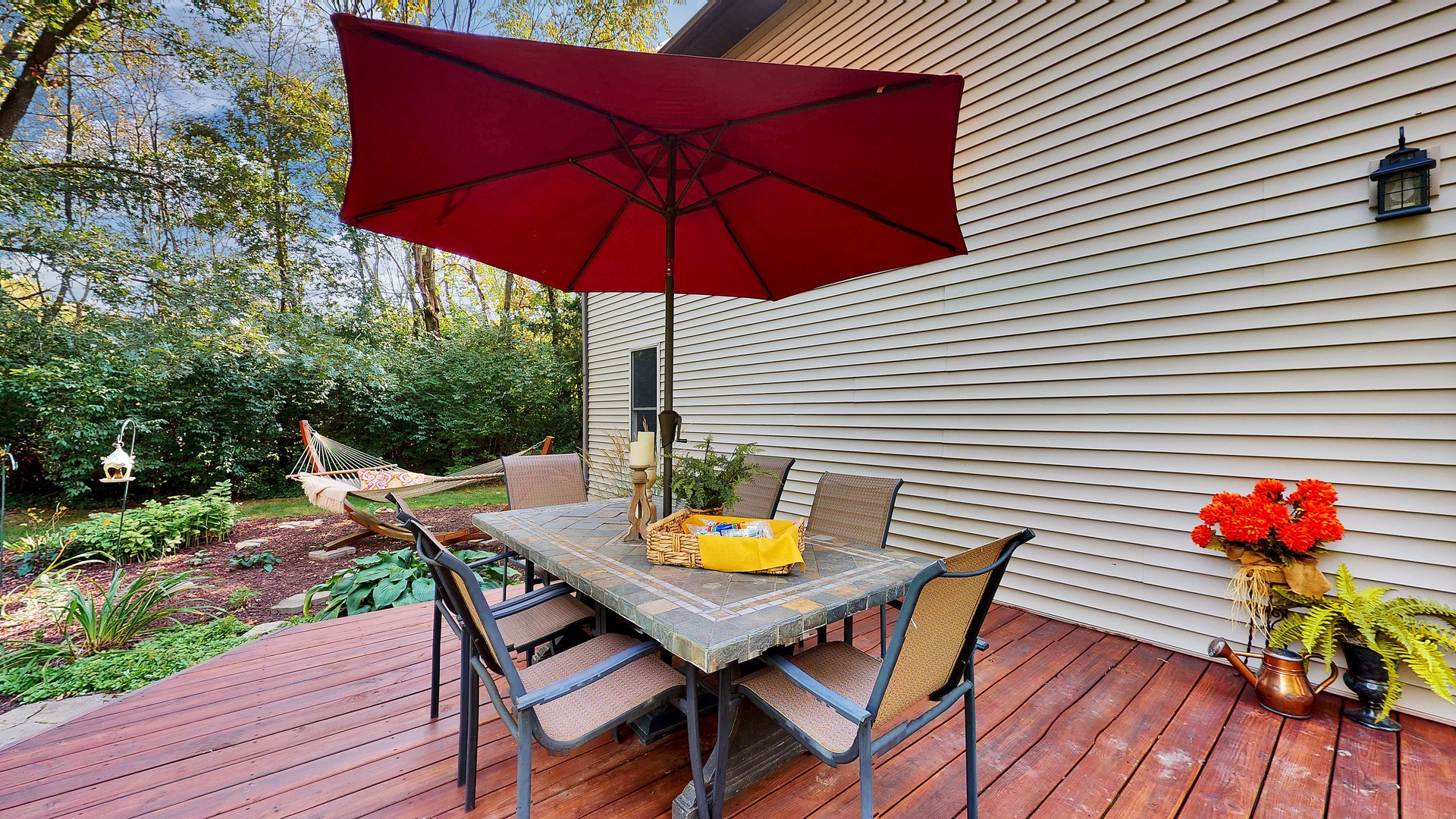 804 Kickapoo Drive Danvers, IL 61732 - Photo 12 of 33 a balcony view with table and chairs under an umbrella