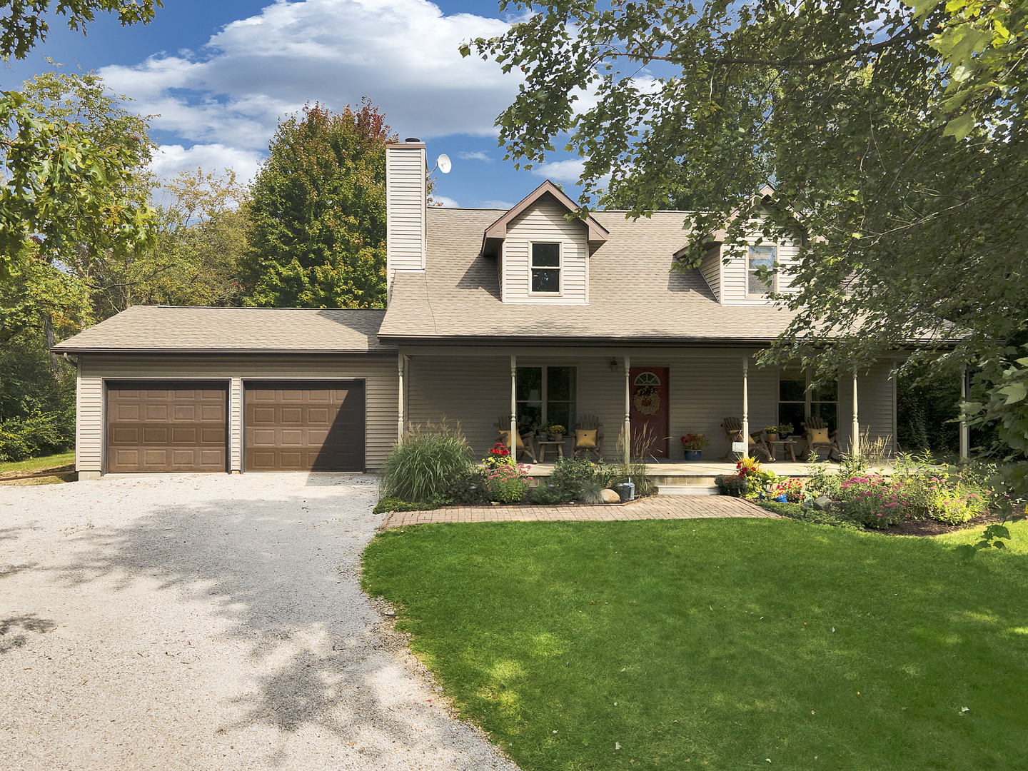 804 Kickapoo Drive Danvers, IL 61732 - Photo 21 of 33 a front view of house with a garden and patio