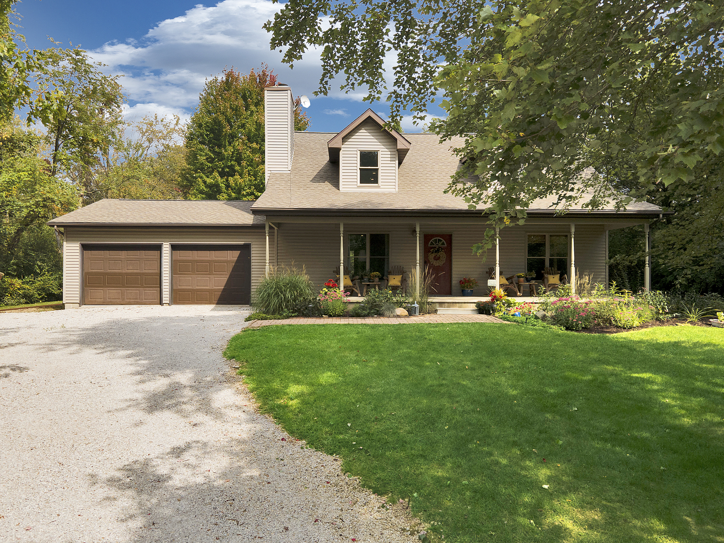 804 Kickapoo Drive Danvers, IL 61732 - Photo 22 of 33 a front view of a house with a yard and a garage