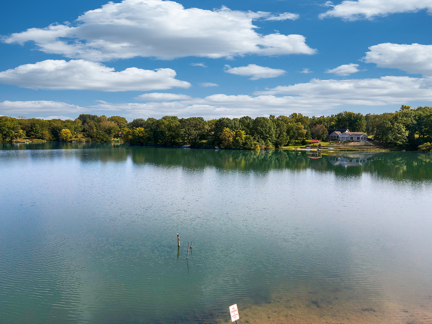 804 Kickapoo Drive Danvers, IL 61732 - Photo 29 of 33 a view of a lake with houses in the back