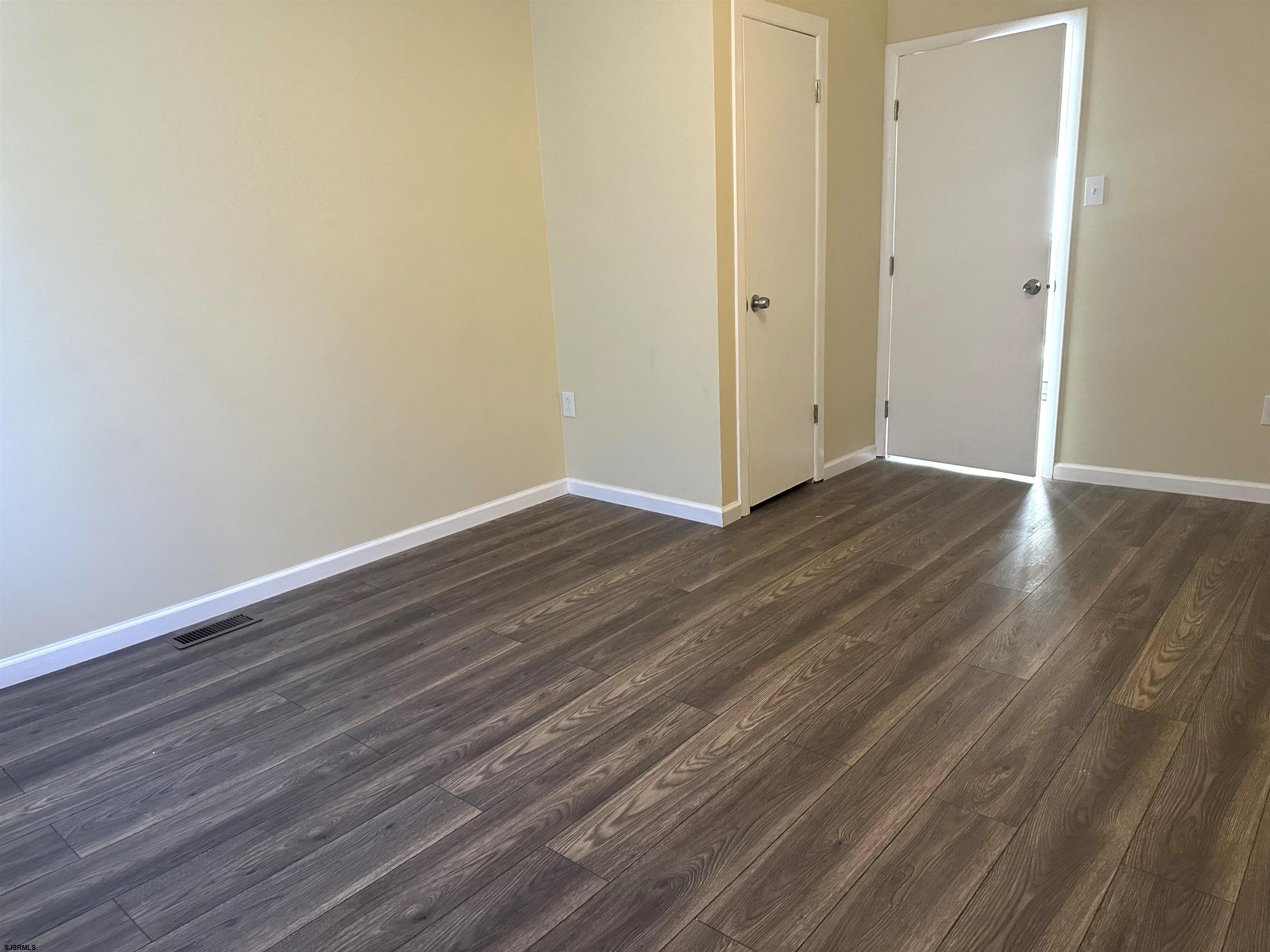 2 Creek Road Absecon, NJ 08201 - Photo 12 of 24 a view of an empty room with wooden floor
