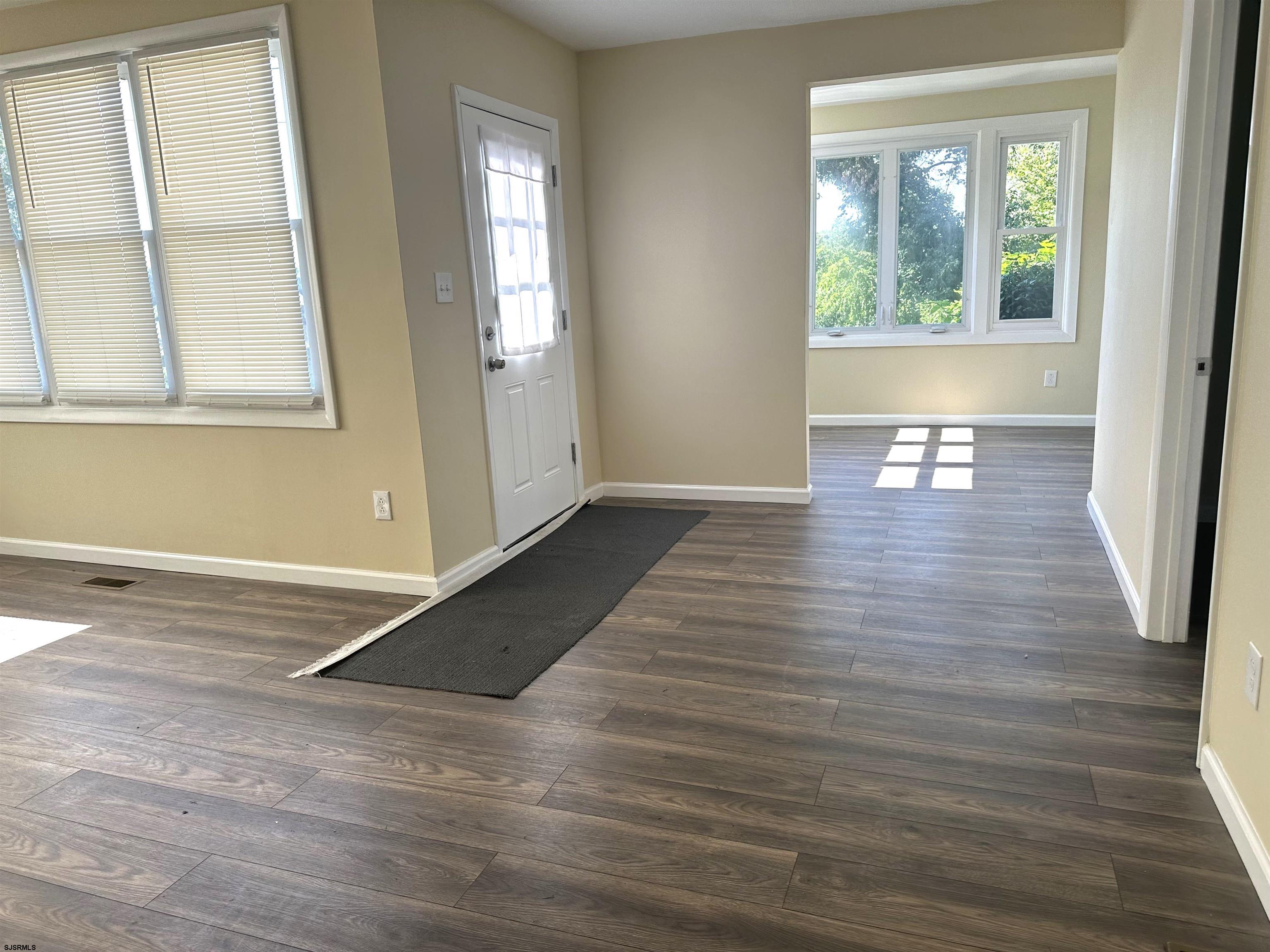 2 Creek Road Absecon, NJ 08201 - Photo 15 of 24 a view of empty room with wooden floor and fan