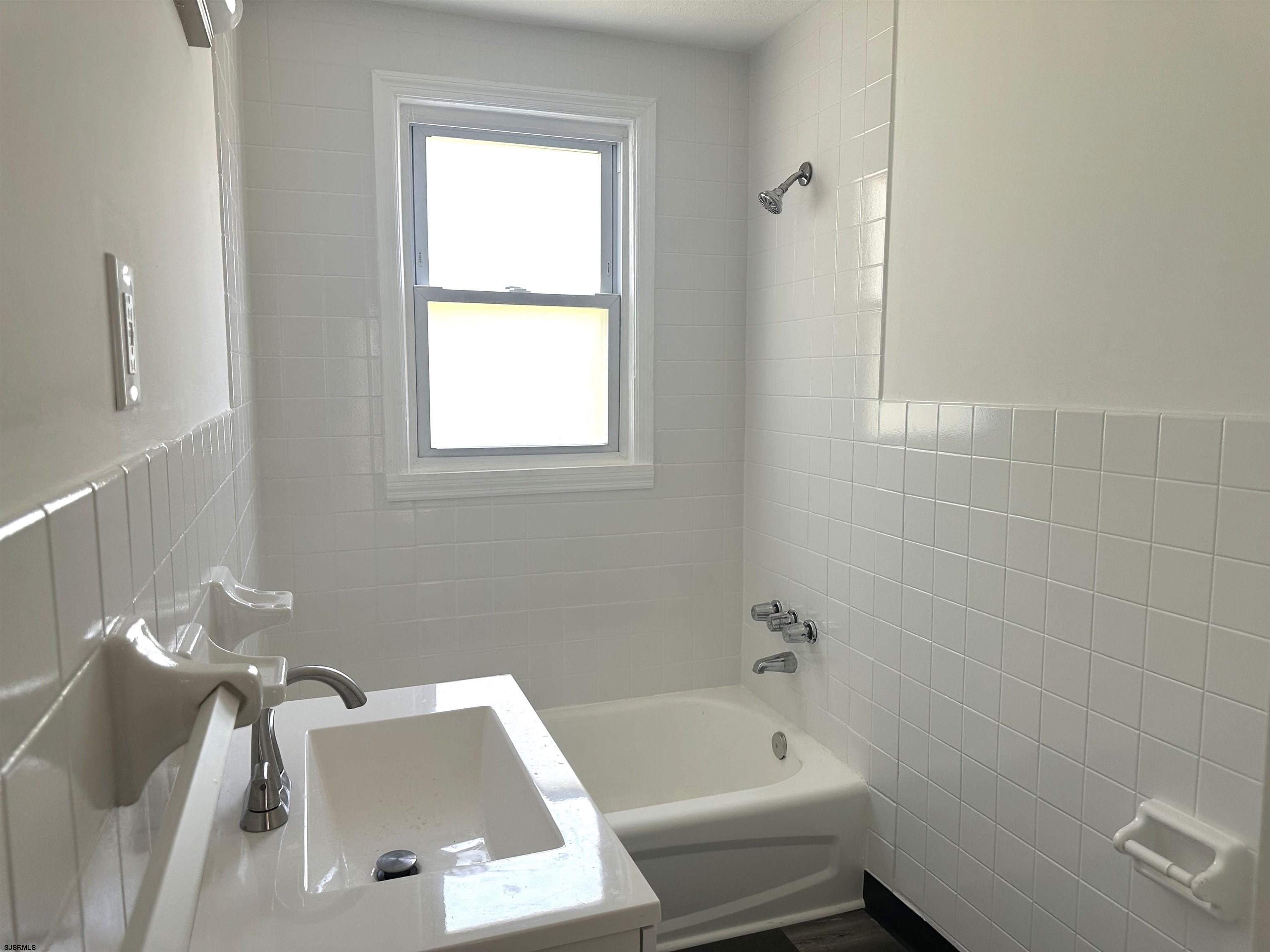 2 Creek Road Absecon, NJ 08201 - Photo 17 of 24 a bathroom with a bathtub and window