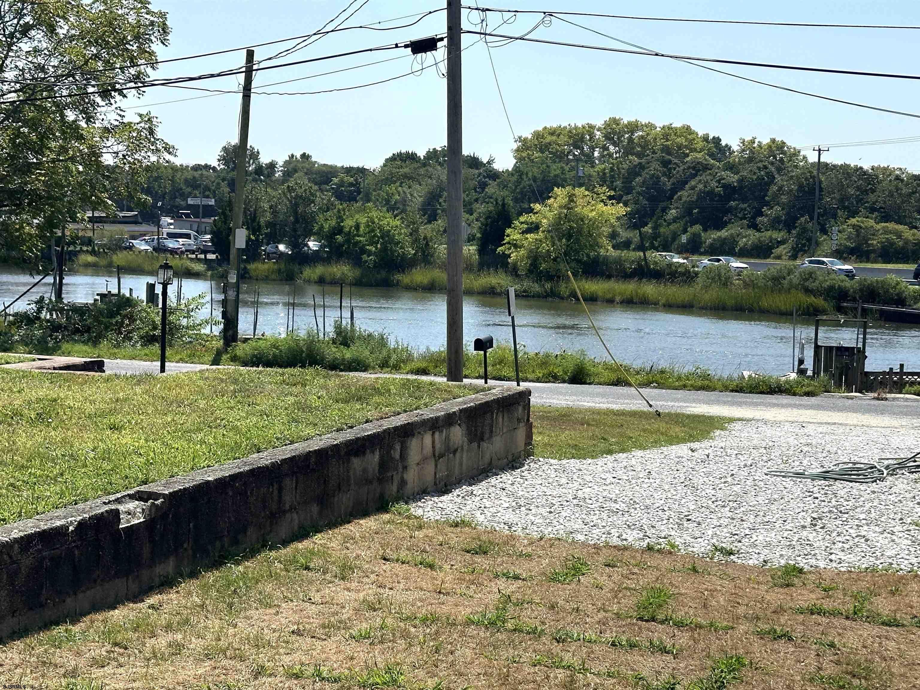 2 Creek Road Absecon, NJ 08201 - Photo 24 of 24 a view of a lake with a mountain in the background