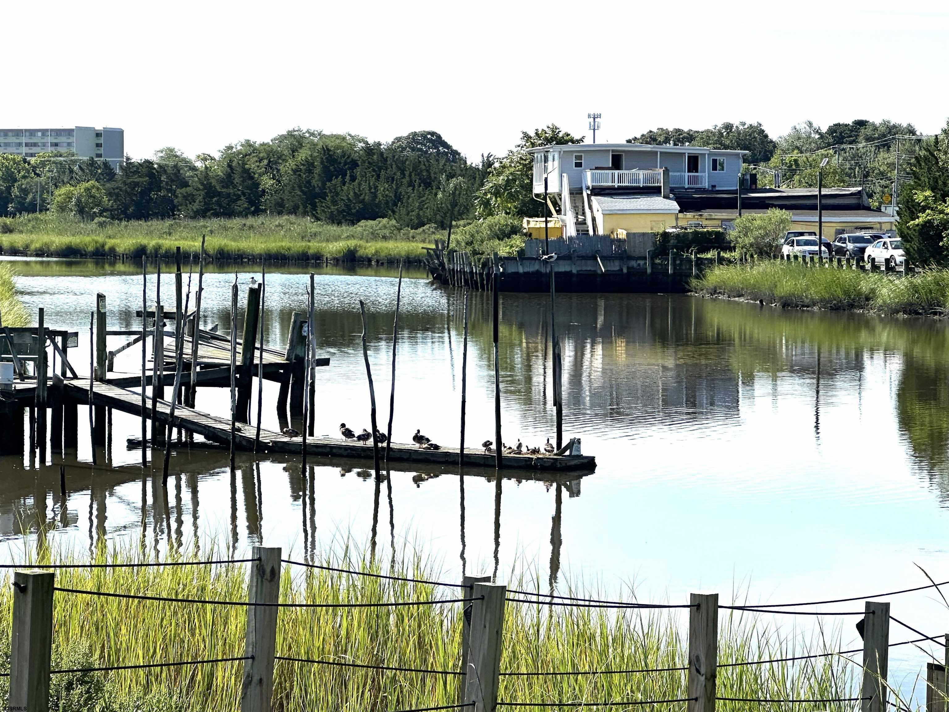 2 Creek Road Absecon, NJ 08201 - Photo 4 of 24 a view of a lake with a mountain view