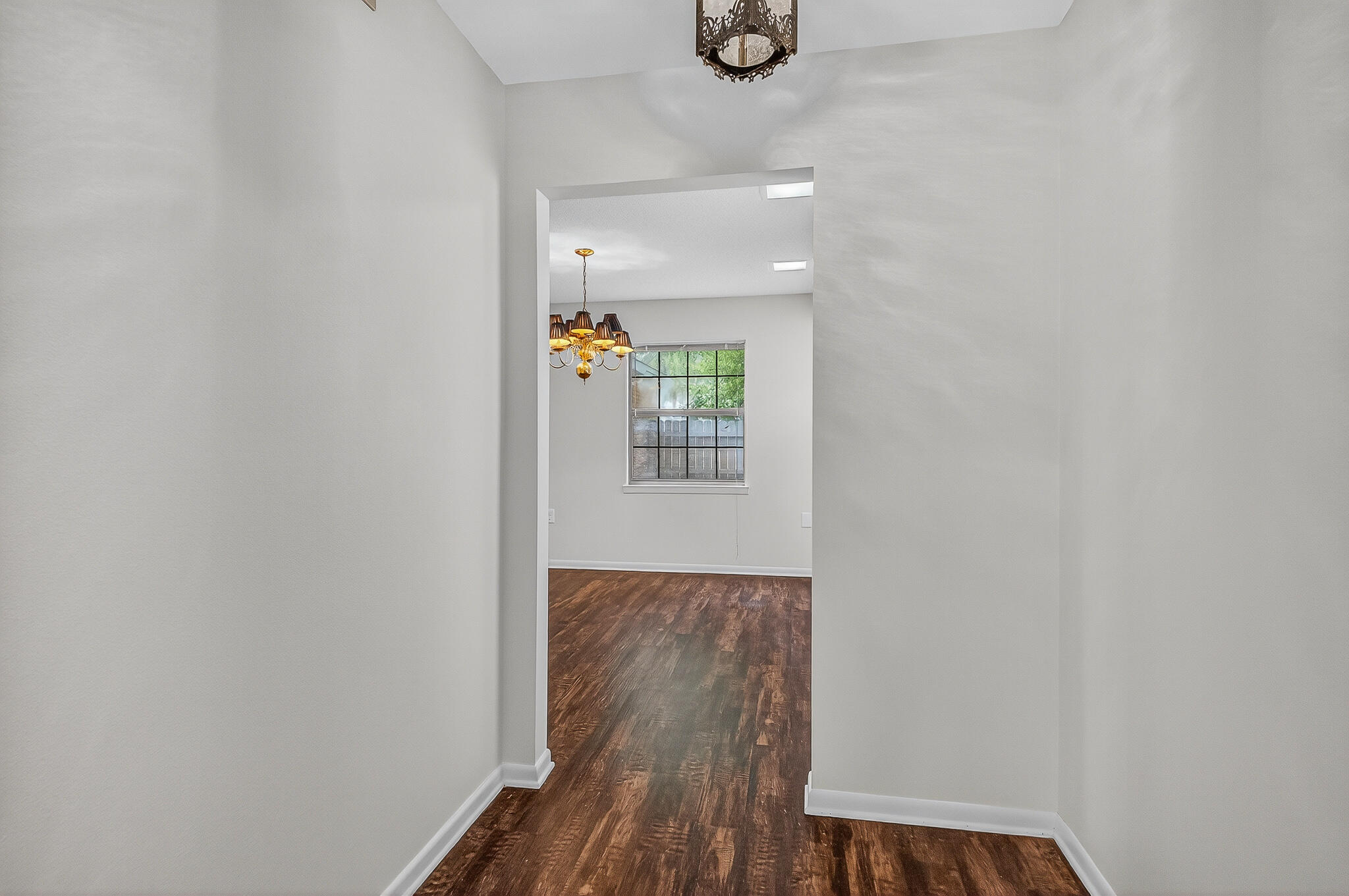 96 Yacht Club Drive, Unit 1 Fort Walton Beach, FL 32548 - Photo 11 of 43 a view of a hallway with wooden floor and a window
