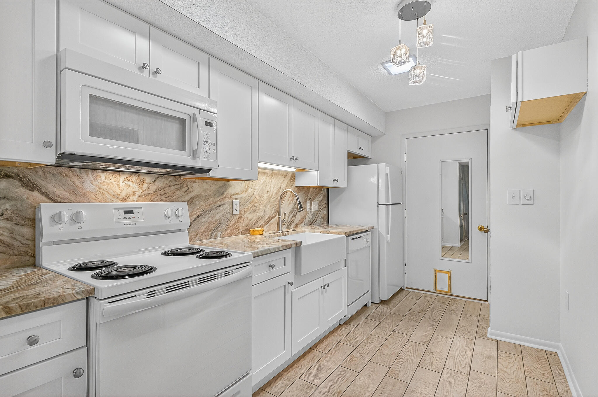 96 Yacht Club Drive, Unit 1 Fort Walton Beach, FL 32548 - Photo 18 of 43 a kitchen with stainless steel appliances a stove refrigerator and cabinets