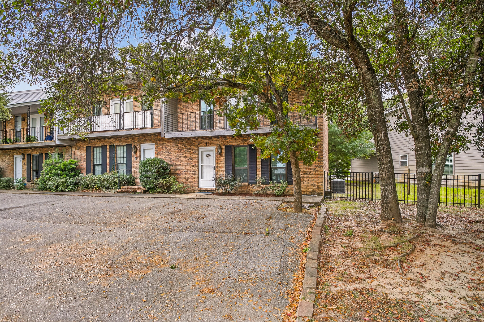 96 Yacht Club Drive, Unit 1 Fort Walton Beach, FL 32548 - Photo 2 of 43 a house with trees in front of it