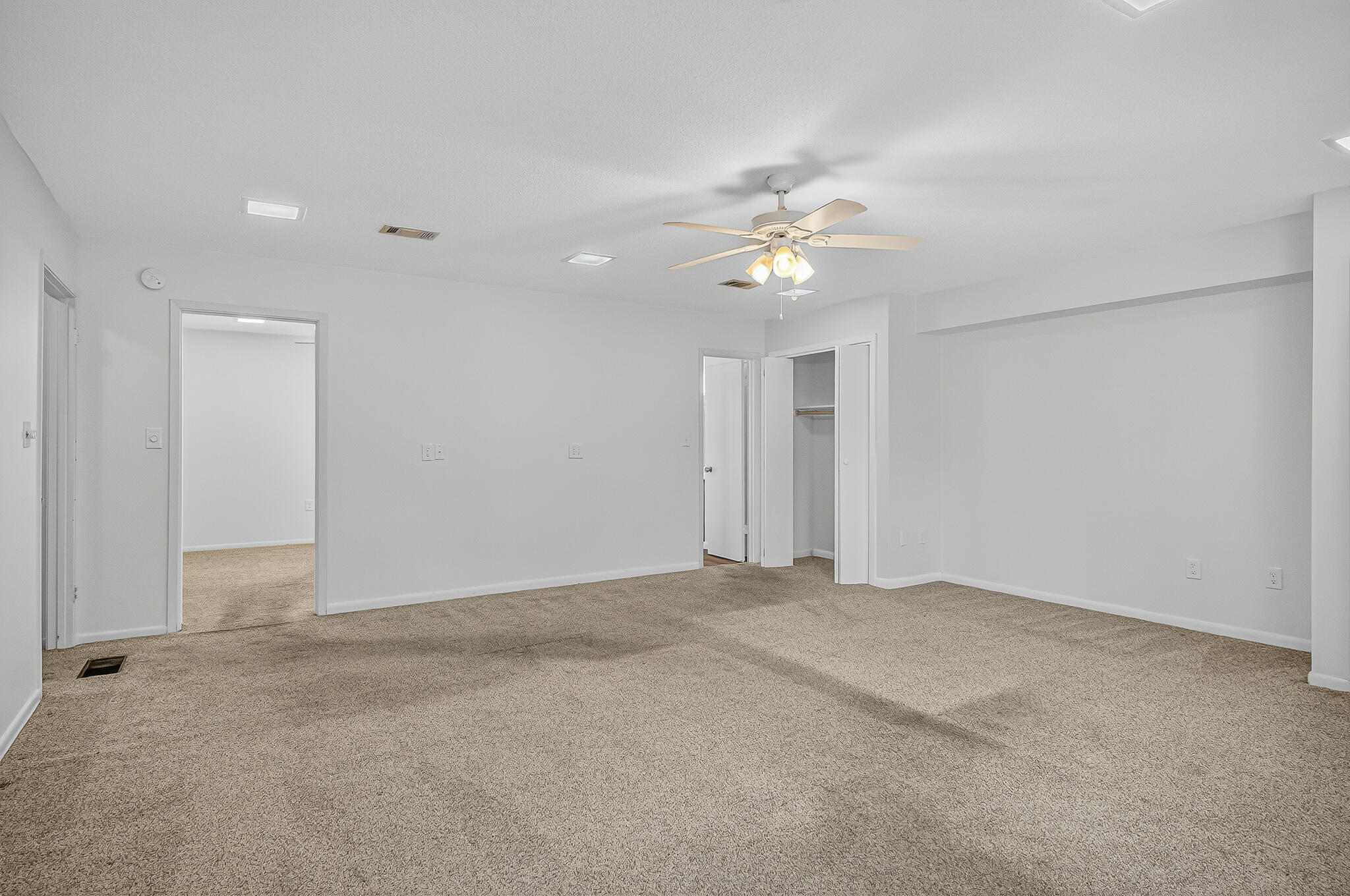 96 Yacht Club Drive, Unit 1 Fort Walton Beach, FL 32548 - Photo 30 of 43 a view of an empty room with a ceiling fan
