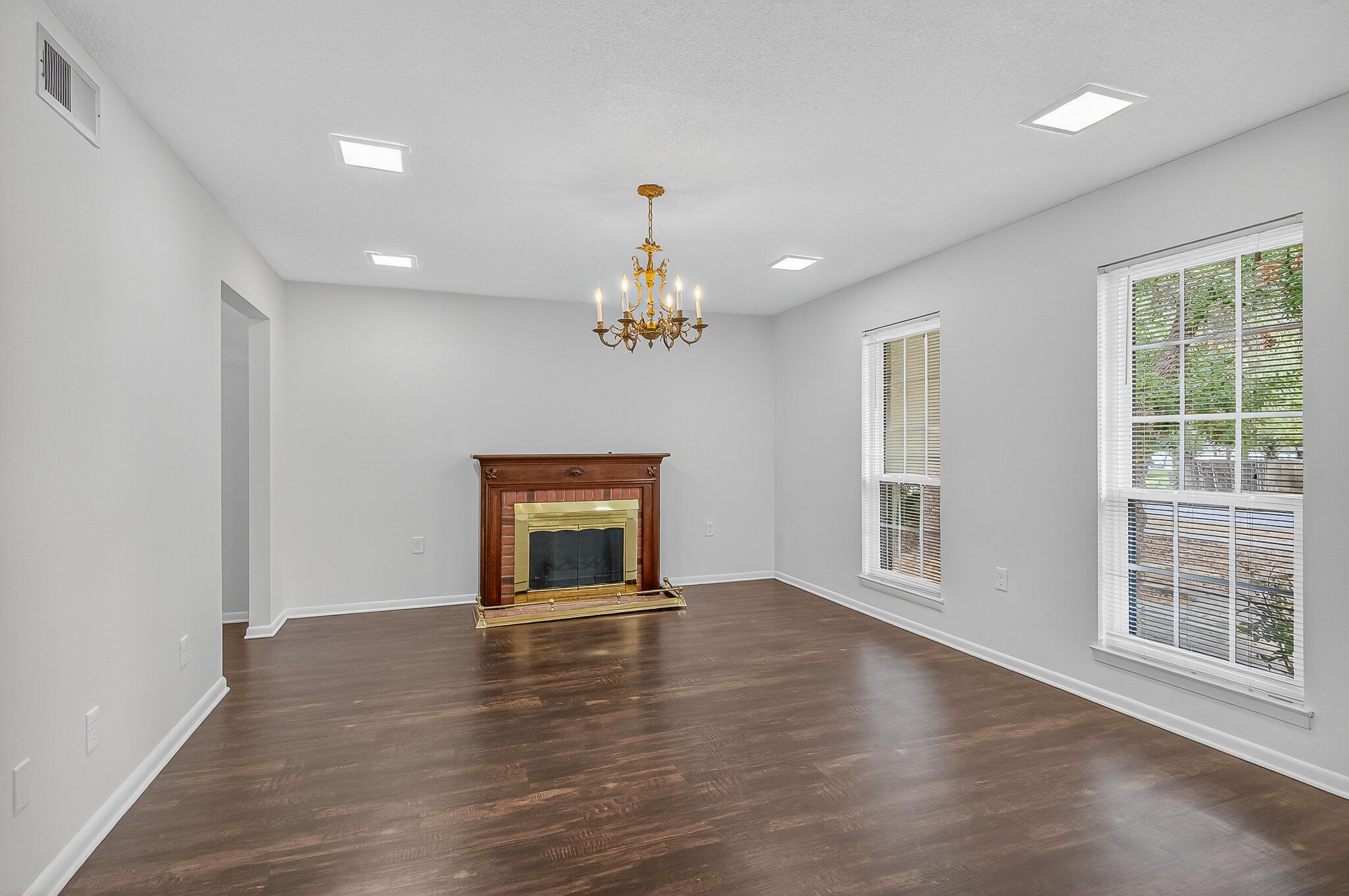 96 Yacht Club Drive, Unit 1 Fort Walton Beach, FL 32548 - Photo 6 of 43 a view of an empty room with a window and wooden floor