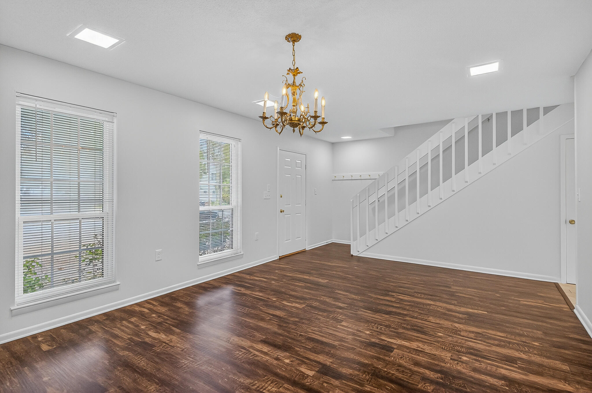96 Yacht Club Drive, Unit 1 Fort Walton Beach, FL 32548 - Photo 8 of 43 a view of an empty room with wooden floor and a window